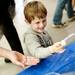Dexter resident Isak Starback, 4, plays with dry ice bubbles during the Mini Maker Faire on Saturday, June 8. Daniel Brenner I AnnArbor.com